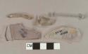 Colorless glass fragments, 2 vessel body fragments, 2 rod fragments, 1 melted fragment