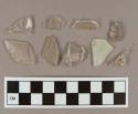 Colorles glass vessel body fragments, 7 flat glass fragments