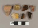 Brown, black, and yellow slip glazed earthenware vessel body fragments, 13 red paste, 6 buff paste, 2 gray paste