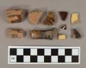 Black, brown, and yellow slip-glazed vessel body fragments, 11 red paste, 1 gray paste, 6 buff paste