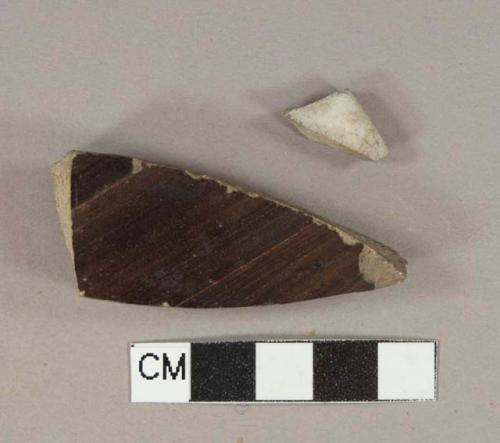 Gray and dark brown salt-glazed stoneware vessel body fragments, gray paste