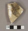 Beige salt glazed stoneware vessel body fragment, buff paste, remants of impressed lettering "...MT..."