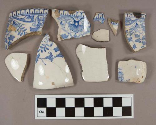 Blue transferprinted whiteware vessel body, base, and rim fragments, 1 frament with partial stamp