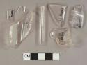 Colorless glass vessel body, shoulder, and rim fragments, 1 tube fragment