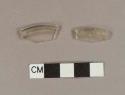 Colorless glass fragments with folded rim; possible base fragments of a stemware vessel