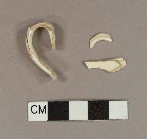 Molded creamware handle sherds; three sherds crossmend