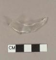 Faceted colorless curved glass fragment; possible tumbler fragment