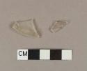 Colorless glass fragments with folded rim; possible stemware base fragments