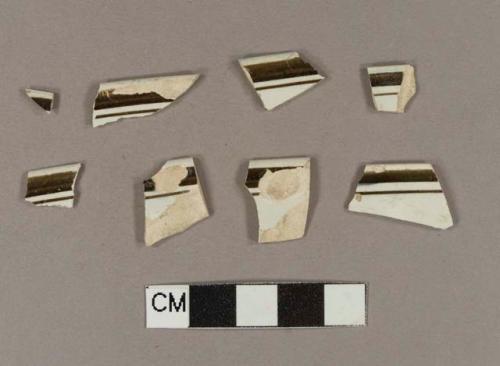 Brown hand painted pearlware rim sherds; two sherds crossmend; three sherds crossmend