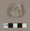 Molded colorless hollowware glass fragment; possible stemware fragment
