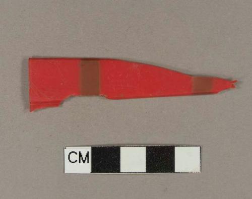 Red plastic fragment