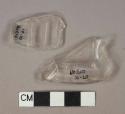 Colorless glass bottle body fragments, 1 fragment with molded lettering "TU[...]"