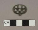 Brass decorated oval fragment, possible key bow