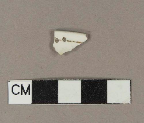 Whiteware rim sherd with overglaze gilded stripe