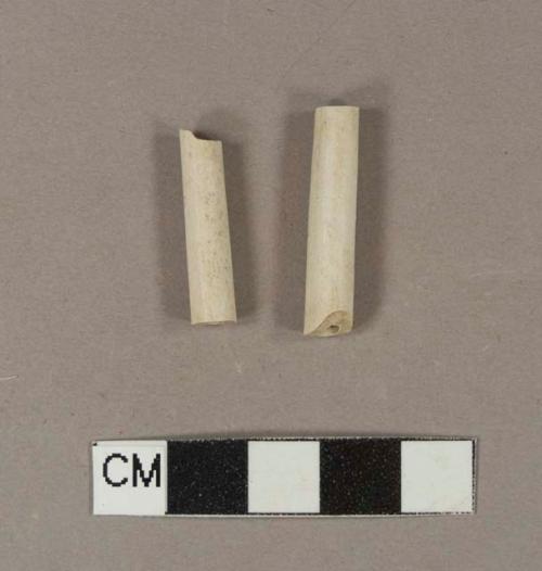 Unsmoked, undecorated pipe stem fragments; two fragments crossmend; 6/64" bore diameter