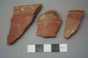 Cusipata white on red painted potsherds