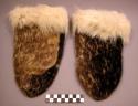 Pair of spotted seal skin mittens with young polar bear cuffs