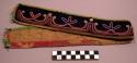 Headband of black cloth trimmed with green cloth with beaded design