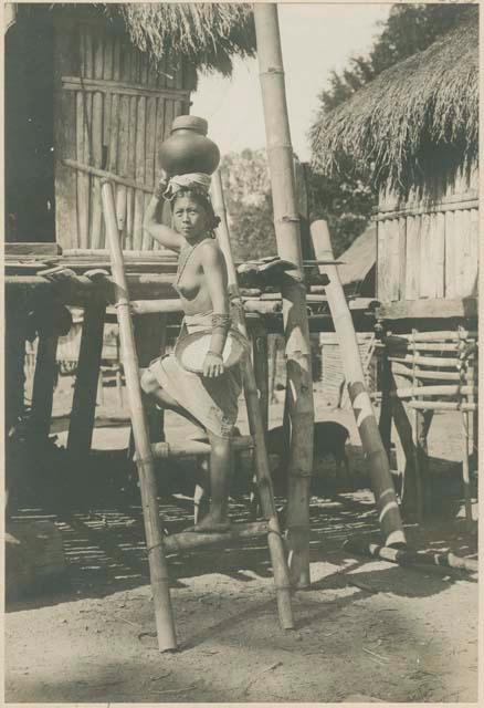 Tinguian woman of San Andres and her house