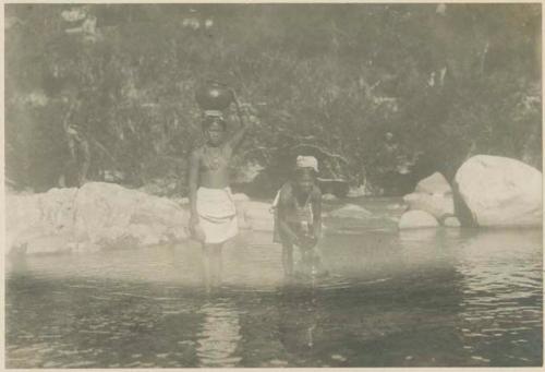 Tinguian girls at stream filling water-pots