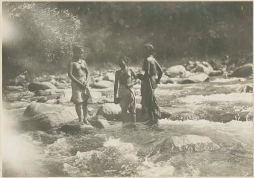 Tinguian women bathing in stream