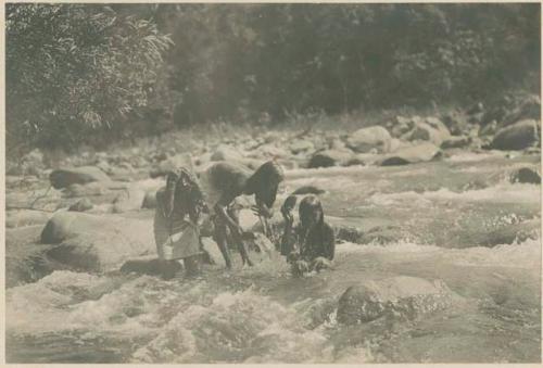 Tinguian women bathing in stream