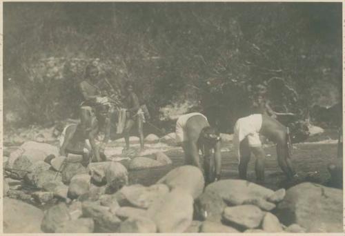 Tinguian people fishing with hands, rod and line, and net