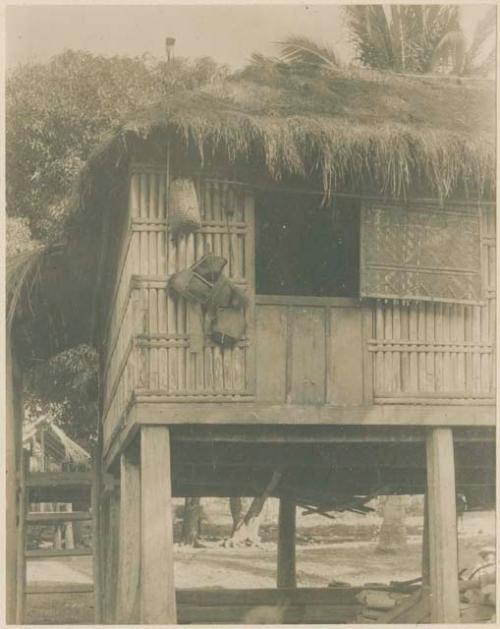 Tinguian house in San Andres, with articles hung to appease evil spirits