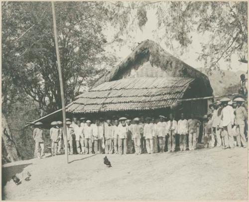 Municipal officials and leading citizens standing in front of municipal building at Danglas