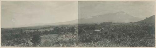 Canlaon Volcano, with buildings and fields in foreground
