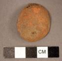 Re-used sherd--fragment of bell. plain, orange