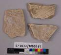 3 potsherds - bisque and greenish paste; decorated;