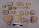 19 potsherds - bisque and greenish paste; decorated;