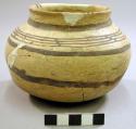 Restored jeddito black-on-yellow pottery jar