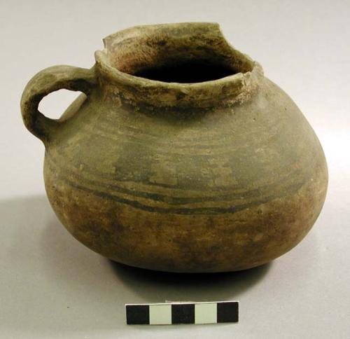 Black on white pottery jug