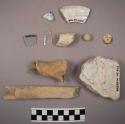 Ceramic, kaolin pipe fragment, bone button, glass fragments, ceramic frags.