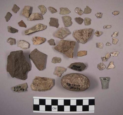 12 pieces bone; 115 chips stone; 25 pieces quartz (some non-quartz); 1 possible