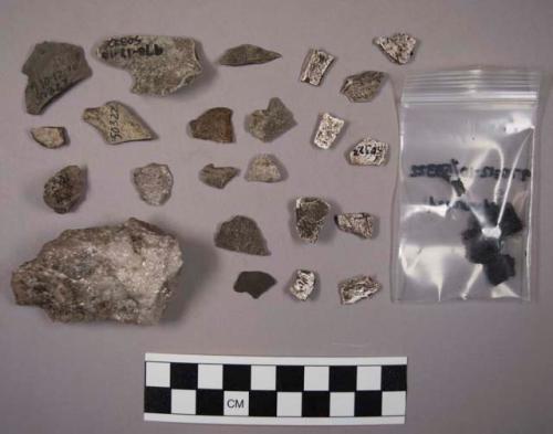 Approx 40 pieces of misc. stone (some shale), approx. 25 pieces of quartz; 7 fra