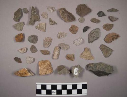 Approx. 165 misc. stone chips (incl. shale); approx. 75 quartz chips; large ston