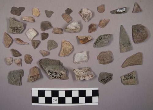 2 fragments of flaked stone projectile points; large lump quartz; approx. 80 qua
