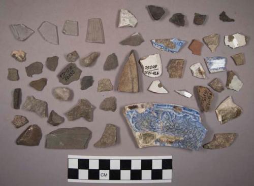 Stone chip, glazed potsherds, coarse potsherd, pottery sherd