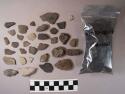 Approx. 20 coarse ware sherds; 85 rock fragments; fragmented worked stone point