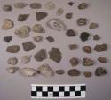 16 potsherds; 1 piece of charocal; approx. 103 stone chips