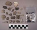 Approx. 108 stone chips; glazed potsherd, 5 pieces of charcoal