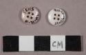 2 four-hole milk glass buttons, 1 decorated