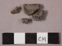 58 stone chips; 2 potsherds; approx. 21 glazed potsherds; 4 fragments of glass;