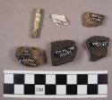 1 kaolin pipe stem, 4 coarse earthenware body sherds, and 1 refined earthenware body sherd