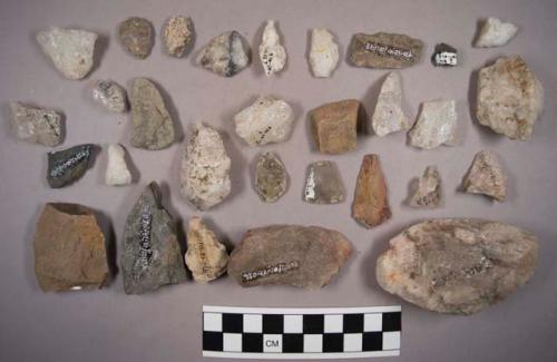 11 bifaces, 22 partial projectile points, 34 pieces chipping debris, and 1 natural stone.