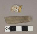 Colorless and yellow plastic sheet fragments, 1 fragment with lettering "Kod[...]"
