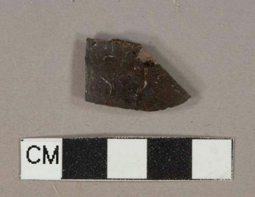 Dark brown slip-glazed redware vessel body fragment